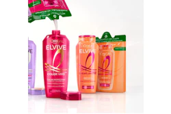 L'Oreal Elvive hair care product lineup featuring Color Vive and Dream Lengths shampoos in pink and orange bottles
