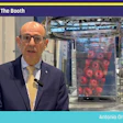 Antonio Orru from ROBOPAC presents live from booth S-3706 at PACK EXPO trade show with packaging equipment visible behind him