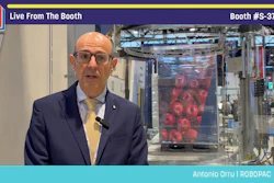 Antonio Orru from ROBOPAC presents live from booth S-3706 at PACK EXPO trade show with packaging equipment visible behind him