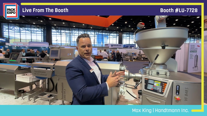 Professional demonstrating industrial packaging equipment at Pack Expo booth LU-7728 trade show