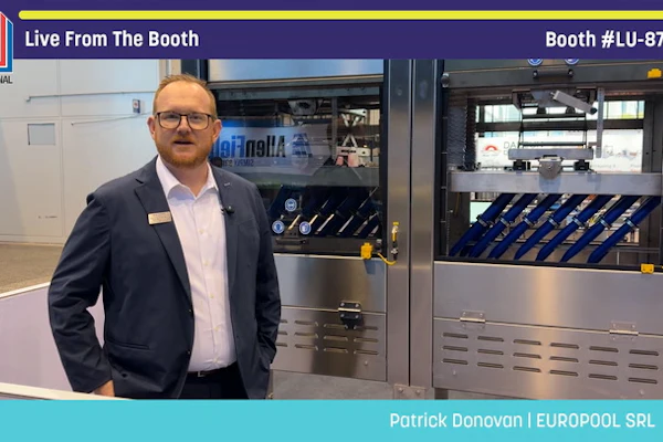 Patrick Donovan from EUROPOOL SRL stands at Pack Expo booth LU-8703 next to industrial packaging machinery