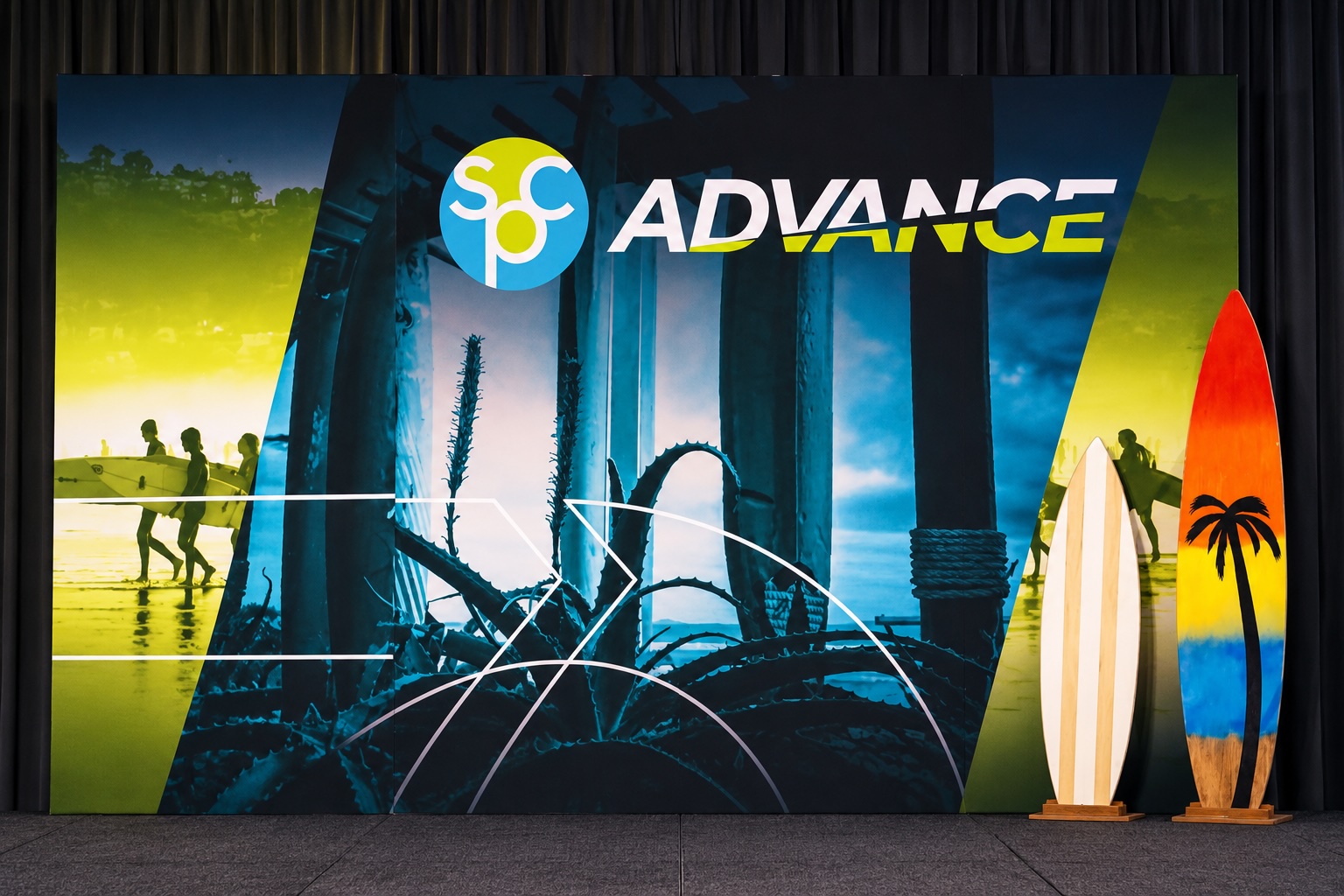 ADVANCE brand storefront display with surfboards and beach-themed imagery featuring pier architecture