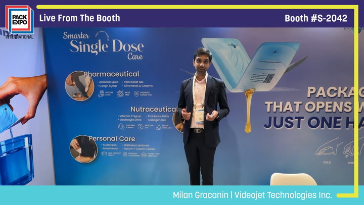 Presenter demonstrating single-dose pharmaceutical packaging at Pack Expo booth S-2042