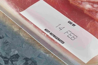 White product label with text on textured red and blue surface packaging