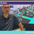 Man in Siemens polo shirt presents industrial automation equipment at Pack Expo booth S-4266