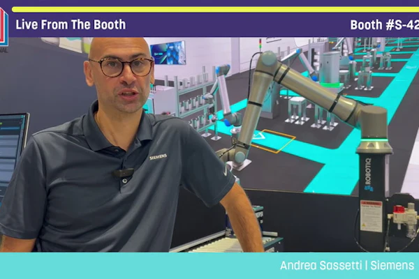Man in Siemens polo shirt presents industrial automation equipment at Pack Expo booth S-4266